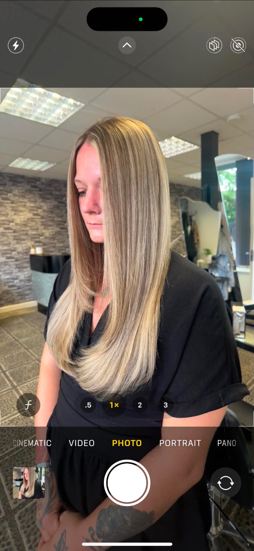 Long blonde balayage styled sleek and straight