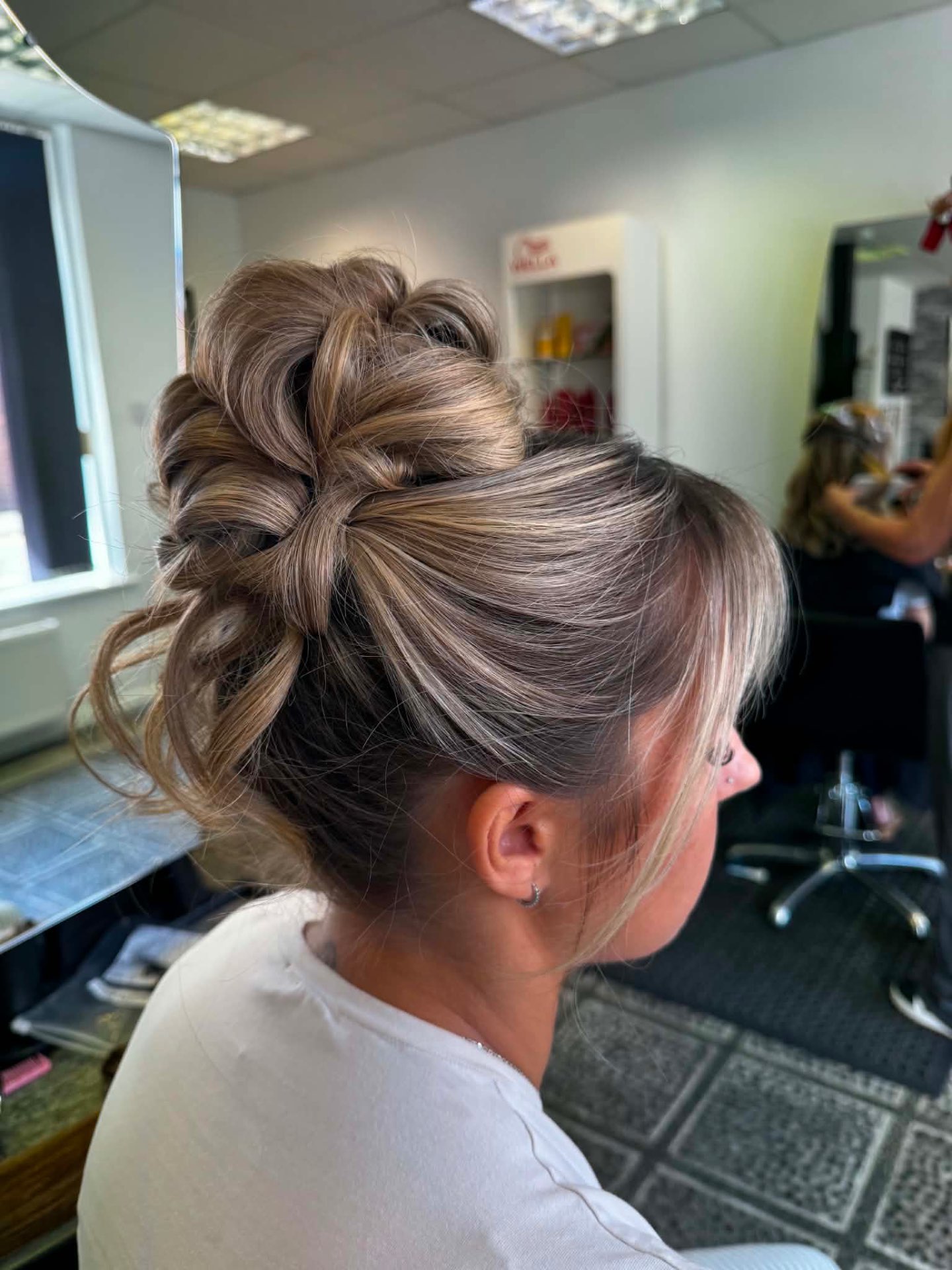 Blonde textured updo with twisted volume