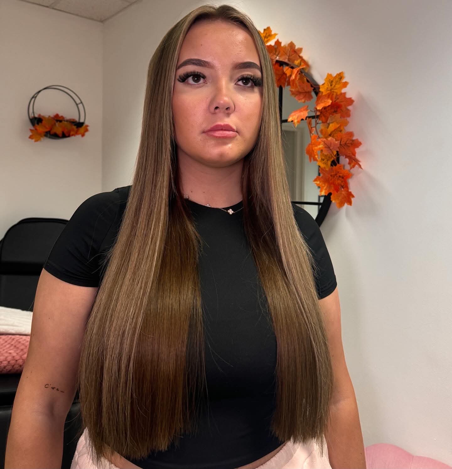 Long brunette hair styled poker straight